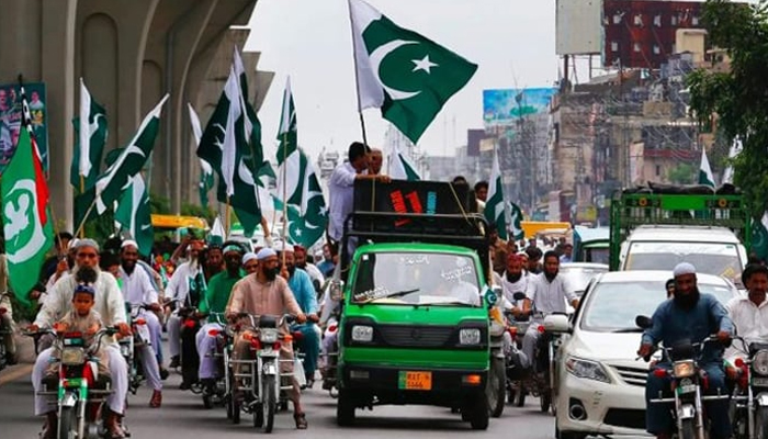 An independence day rally is seen on a road during the 14th August celebrations in this undated image. — APP/File