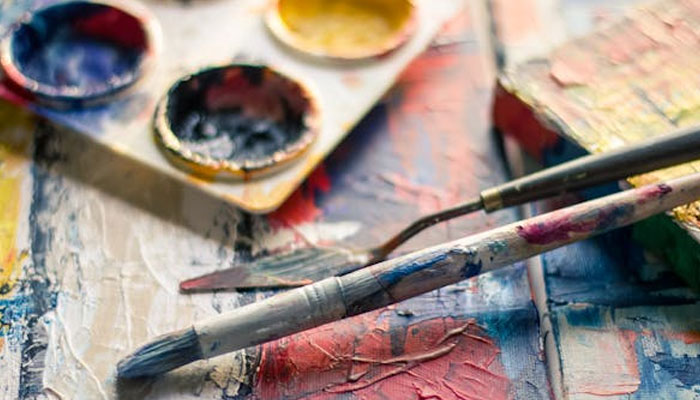 A representational image of paint brushes and paint. — Pexels/File