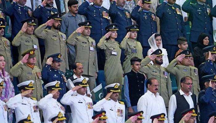 This representational image shows Pakistani armed forces officials salute as they listen to the national anthem during the Independence Day ceremony in Islamabad. — AFP/File