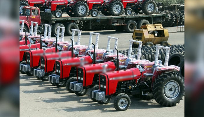 This representational image shows, tractors are parked in a manufacturing factory. — APP/File