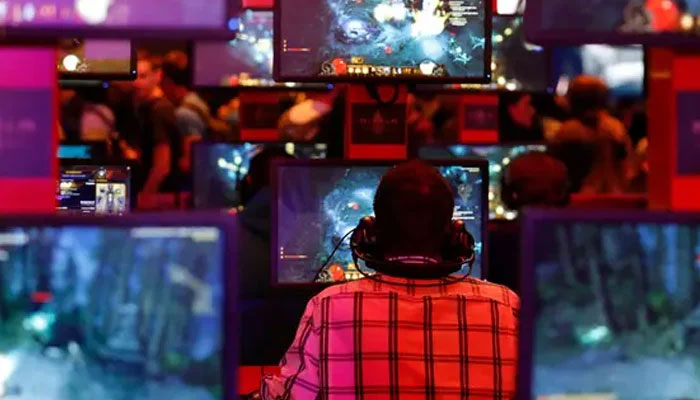 A representational image showing a person playing a video game. — Reuters/File