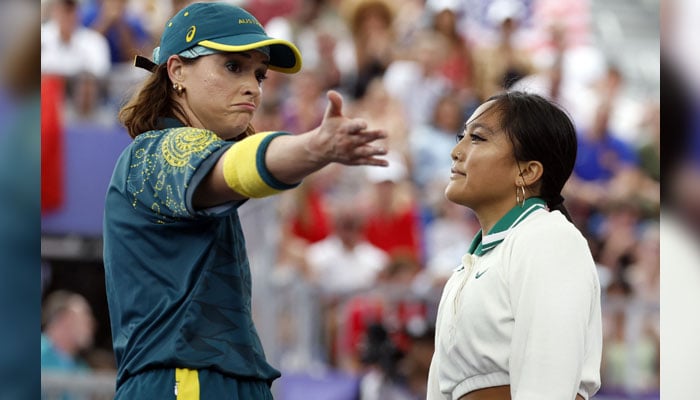 Australias Rachael Gunn (L), known as Raygun gestures next to US Logan Edra, known as Logistx, during their battle as part of the Womens Breaking Dance Round robin of the Paris 2024 Olympic Games in Paris, on August 9, 2024. — AFP