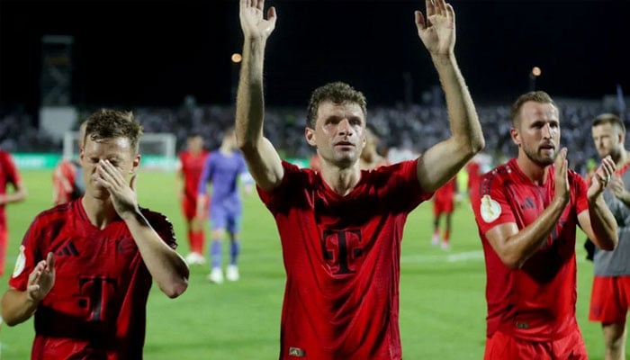 Bayern Munichs Thomas Mueller, Joshua Kimmich and Harry Kane celebrate after the match. — Reuter/file