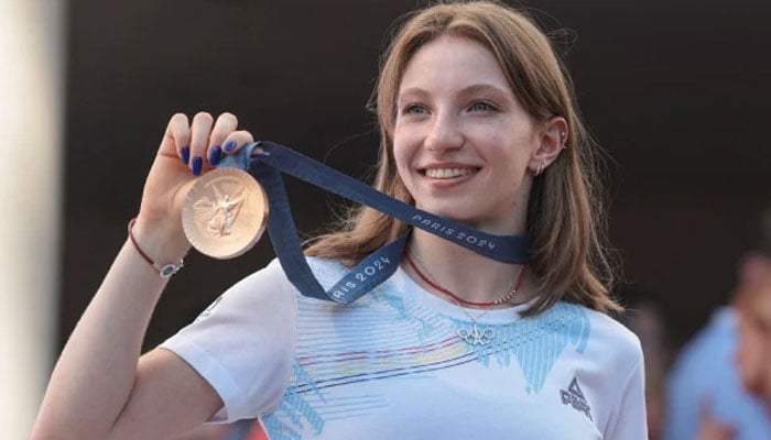 Romanian gymnast Ana Barbosu shows her Olympic bronze medal in Bucharest, Romania, August 16, 2024. — Reuters