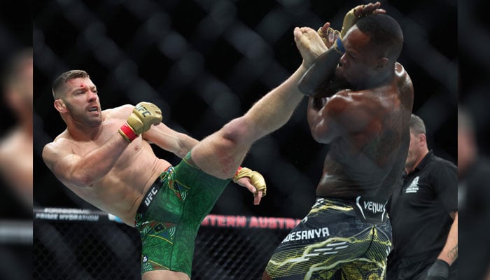 South Africas Dricus Du Plessis (L) and New Zealands Israel Adesanya fight in their mens middleweight division event of the Ultimate Fighting Championship (UFC) 305 in Perth, Australia  on August 18, 2024. — AFP