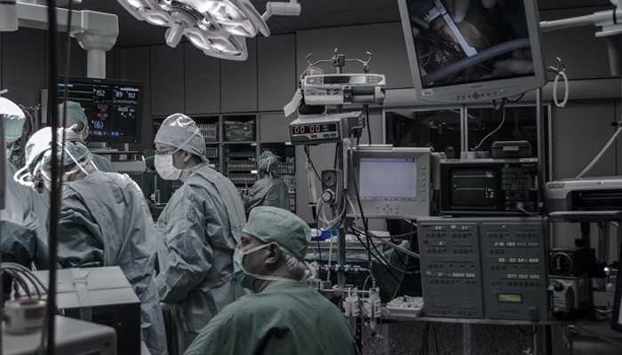 A representative image shows doctors performing an operation in an operating room. — Unsplash/File