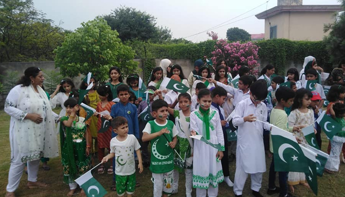 Children at House of Blessing wave national flags in relation to Independence Day celebrations. — Facebook/@CDRSHouseOfBlessings/File