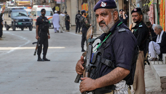 A representational image showing police personnel standing guard in Peshawar, Khyber Pakhtunkhwa. — AFP/File