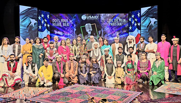 USAID Mission Director Kate Somvongsiri (4th from centre), Director General PNCA Ayoub Jamali (8th from left), music composer Ali Ashraf (centre) pose for a group photo at PNCA on August 19, 2024. — Facebook/@USAIDPakistan