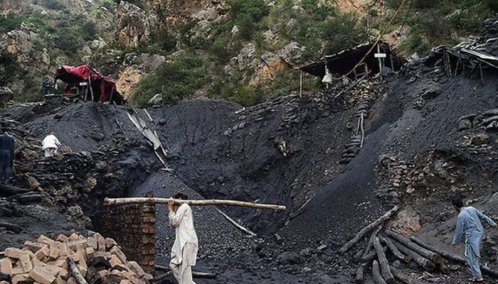 Miners fix a collapsed coal mine in Akhurwal village seen in this image. — AFP/File