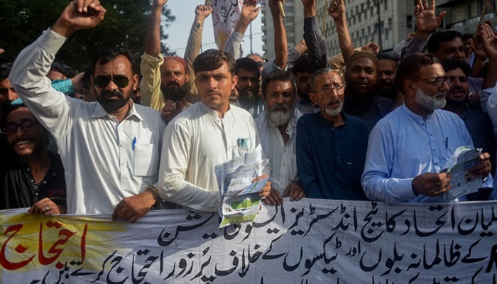 A representational image shows traders shouting slogans during a protest against the surge in other taxes prices on August 30, 2023. — AFP