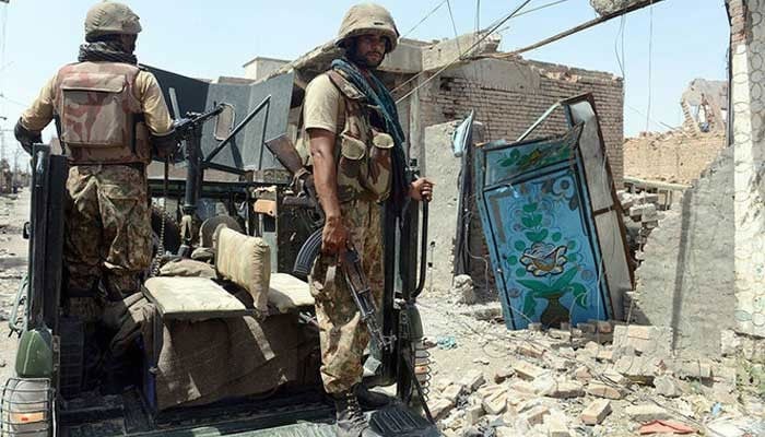 Pakistan Army soldiers patrol in an undisclosed location during a military operation.  — AFP/File