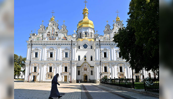 A monk walks past the Uspenskyi cathedral at Kyiv Pechersk Lavra in Kyiv on August 20, 2024. — AFP