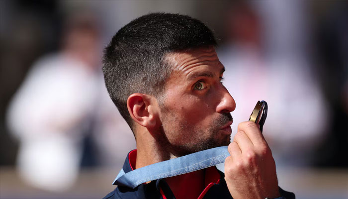 Paris Olympics 2024 gold medallist Novak Djokovic of Serbia poses with his medal. — Reuters/file