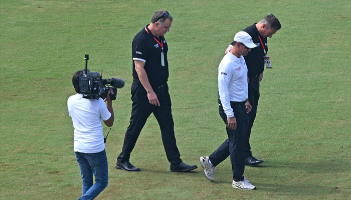 Umpires Richard Kettleborough of England (R) and Adrian Holdstock of South Africa (2L) inspect the pitch at the Rawalpindi Cricket Stadium on August 21, 2024.— AFP/file