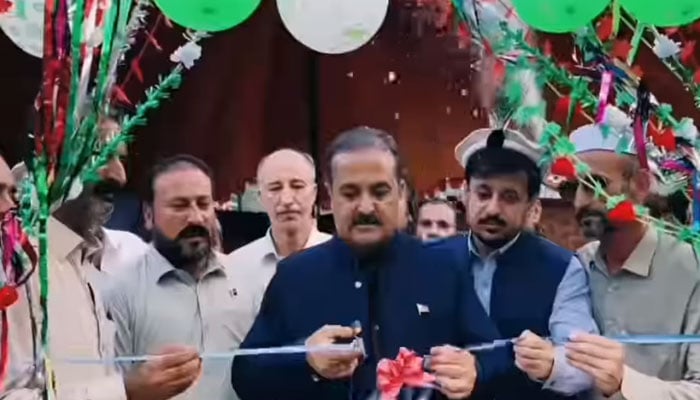 Deputy Commissioner Upper Dir Naveed Akbar cuts a ribbon to inaugurate the All-Pakistan Volleyball Tournament of Dir Sports Complex on August 15, 2024. — screengrab via Facebook/DCUpperDir