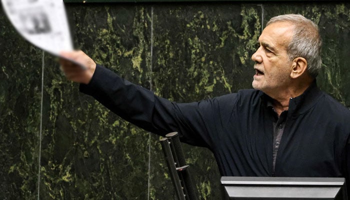 Irans President Masoud Pezeshkian addresses parliament during a session to approve his new cabinet appointments in Tehran on August 21, 2024. — AFP