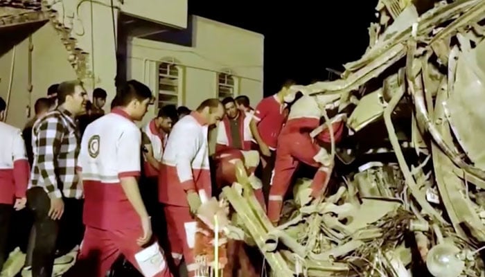 Rescuers work at the scene of a bus accident in Yazd province, Iran, in this still image taken from a video, August 21, 2024. — Reuters