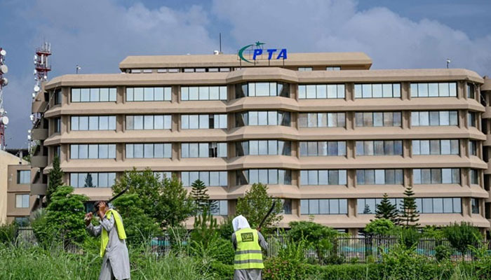 People work near the Pakistan Telecommunication Authority (PTA) headquarters building in Islamabad on August 16, 2024. — AFP