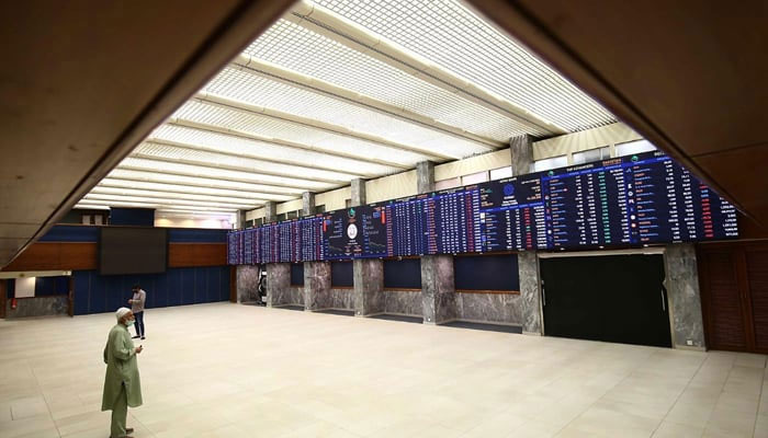 An investor can be seen looking at the digital stock board at the Pakistan Stock Exchange. — AFP/File