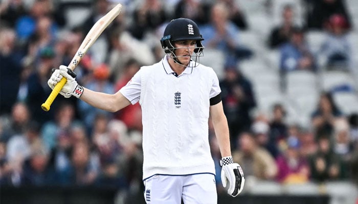 England´s Harry Brook celebrates his half-century on day two of the first Test match between England and Sri Lanka at Old Trafford cricket ground in Manchester, north-west England on August 22, 2024.— AFP