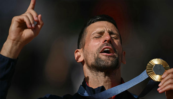 Novak Djokovic celebrates clinching the Olympic title.— AFP/file