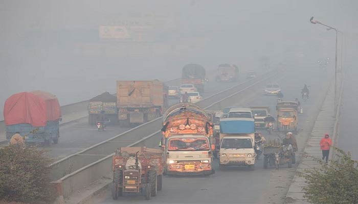 Vehicles move amid dense smog in Lahore, Pakistan. — Reuters/File