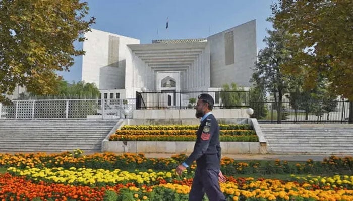 A policeman walks past the Supreme Court building in Islamabad, Pakistan, on November 28, 2019. — AFP