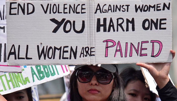 A woman holds a placard during a protest against the rape of an eight-year-old girl in Kathua, near Jammu, in Guwahati, India, April 21, 2018. — Reuters