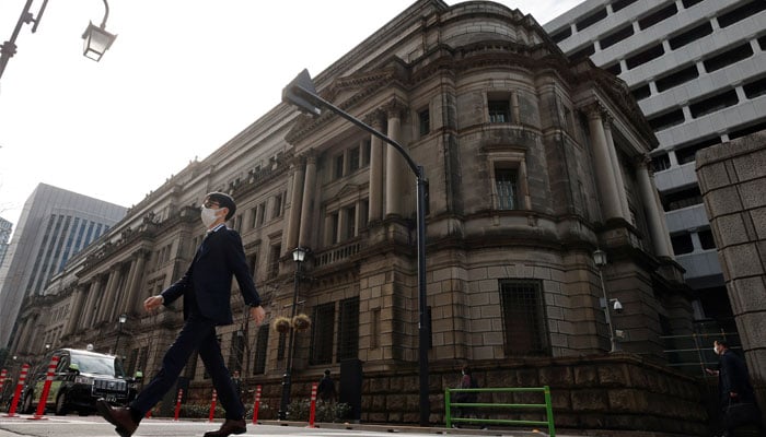 A man walks in front of the headquarters of Bank of Japan in Tokyo, Japan, January 18, 2023. — Reuters