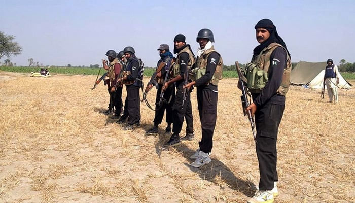 This undated photo shows policemen stand prepare to take part in an operation against criminals in Rajanpur, Punjab. — AFP/File