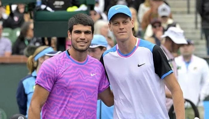 Spains Carlos Alcaraz (left) and World number one Jannik Sinner poses for a photo during a tennis match. — Reuters/File