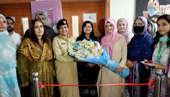 Brigadier Dr Helen Mary is pictured receiving a bouquet of flowers during the inaugural ceremony of Helen Mary Robert chair for Peace and Conflict Studies at the University of Home Economics in Lahore. —Facebook/ University of Home Economics Lahore