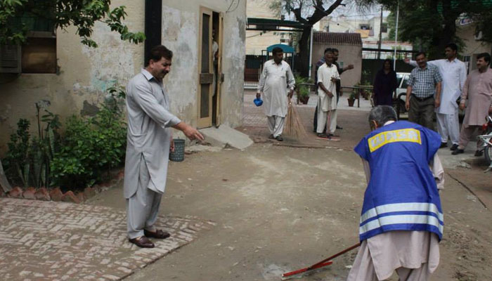 Water and Sanitation Agency (WASA) officials busy in cleaning in a Lahore area. Facebook/WASA Water And Sanitation Agency/File