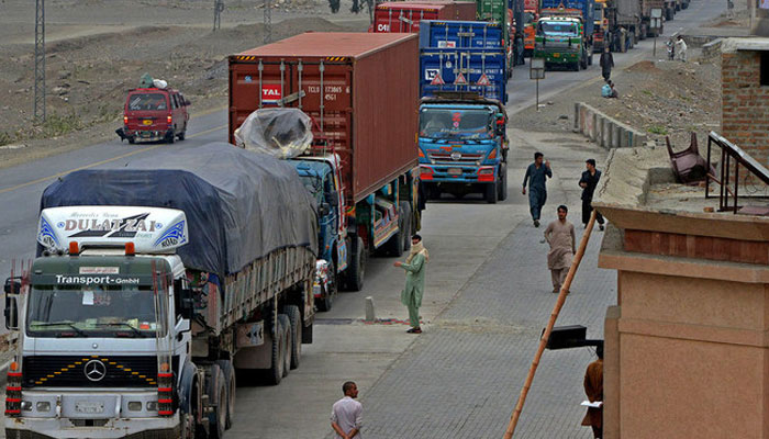 Trucks and other vehicles travel in the mountainous area near Torkham, close to the Pakistan-Afghanistan border. — AFP/File