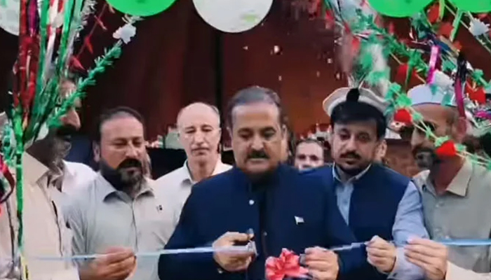 Deputy Commissioner Upper Dir Naveed Akbar cuts a ribbon to inaugurate the All-Pakistan Volleyball Tournament on August 15, 2024. — screengrab via Facebook/@DCUpperDir