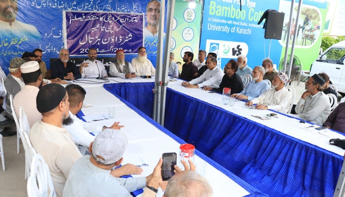 Emir Jamaat-e-Islami Karachi Munem Zafar Khan is addressing a consultative meeting of businessmen regarding nationwide shutter down strike on August 28 at Idara-e-Noor Haq released on August 23, 2024. — Facebook/@Khijamaat