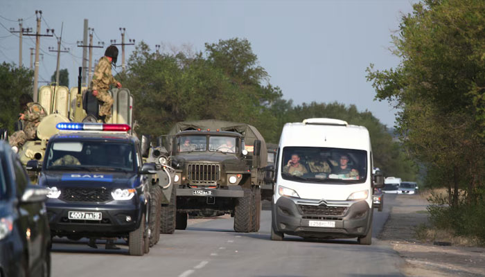 Russian law enforcement officers drive along a road following the seizure of hostages by a group of inmates in the penal colony IK-19, in the town of Surovikino in the Volgograd Region, Russia August 23, 2024. —Reuters