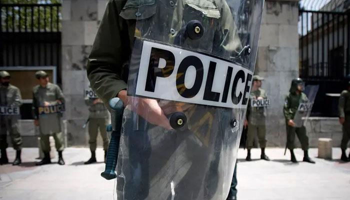 Iranian police stand guard in front of the German embassy during a protest gathering in Tehran July 11, 2009.— Reuters/file