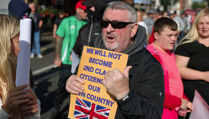 Protesters attend an anti-immigration protest in Belfast, Northern Ireland, August 9, 2024. — Reuters