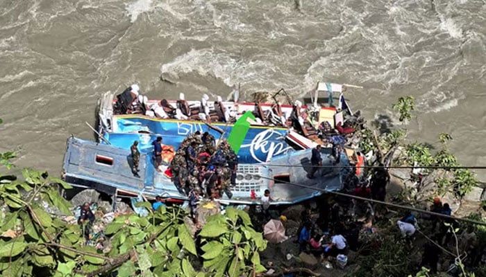 Security force personnel work to rescue injured passengers after a bus carrying Indian passengers traveling to Kathmandu from Pokhara plunged into a river in Tanahun District, Gandaki Province, Nepal August 23, 2024. — Reuters