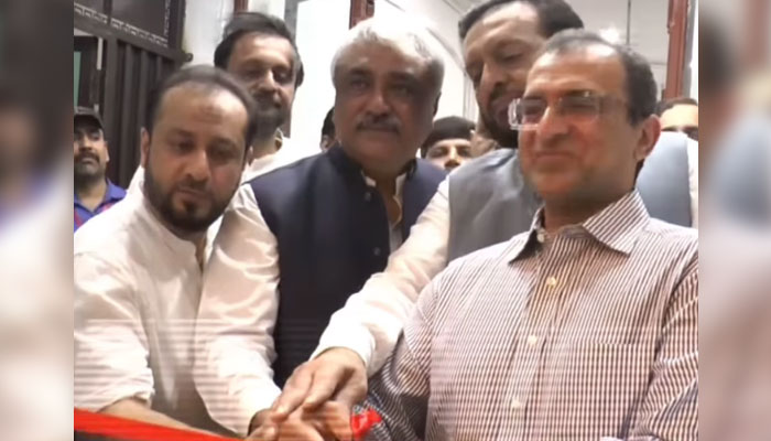 (From left) Punjab Health Ministers Khawaja Imran Nazir and Khawaja Salman Rafique cut a ribbon to inaugurate the new website and digitisation of the classroom project of Mayo Hospital Department of Orthopedic Unit on August 24, 2024. — Screengrab via Facebook/Khawaja Salman Rafique