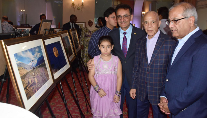 Participants pose for a photo in a photographic exhibition to celebrate 77 years of Pakistans independence on August 25, 2024. — Facebook/Sultan Bashir Photojournalist