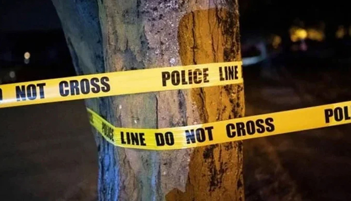 A representational image of a police tape wrapped on a tree at a crime scene. — AFP/File