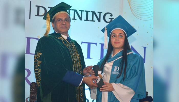 Supreme Court Judge Justice Muhammad Ali Mazhar confers a degree to a female student at the graduation ceremony of Denning Law School on August 24, 2024. — Reporter