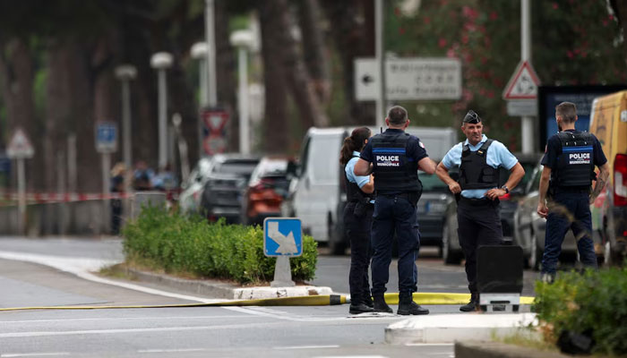 French police stand guard after cars were set on fire in front of the citys synagogue, in La Grande-Motte, France on August 24, 2024. — Reuters