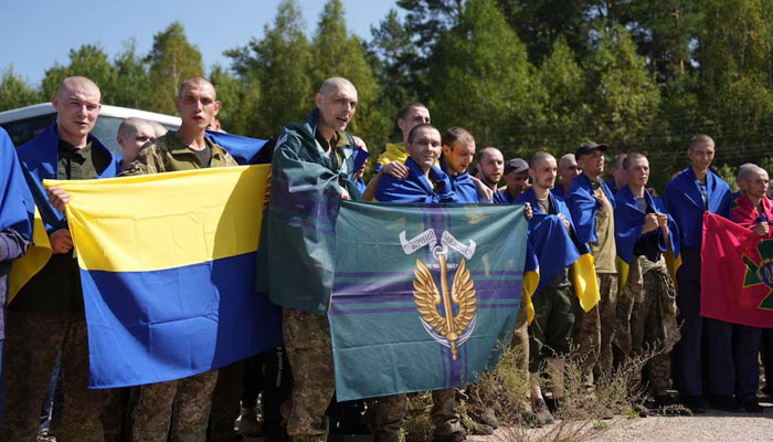 Ukrainian prisoners of war (POWs) react after a swap, amid Russias attack on Ukraine, at an unknown location in Ukraine, in this handout picture released on August 24, 2024. — Reuters