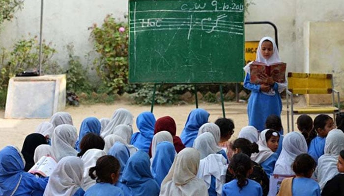 A representational image showing girls attending a class at a school. — AFP/File