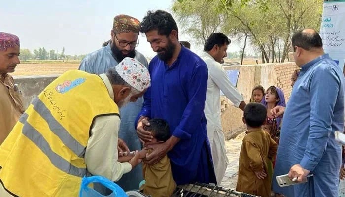 A health worker administrates vaccine to a child. — PPI/File