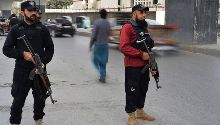 Police officials stand alert in Peshawar. — AFP/File